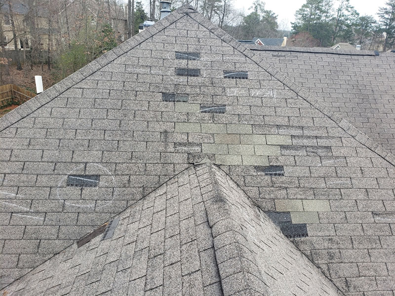 house asphalt shingles roof with damages marked woodstock ga