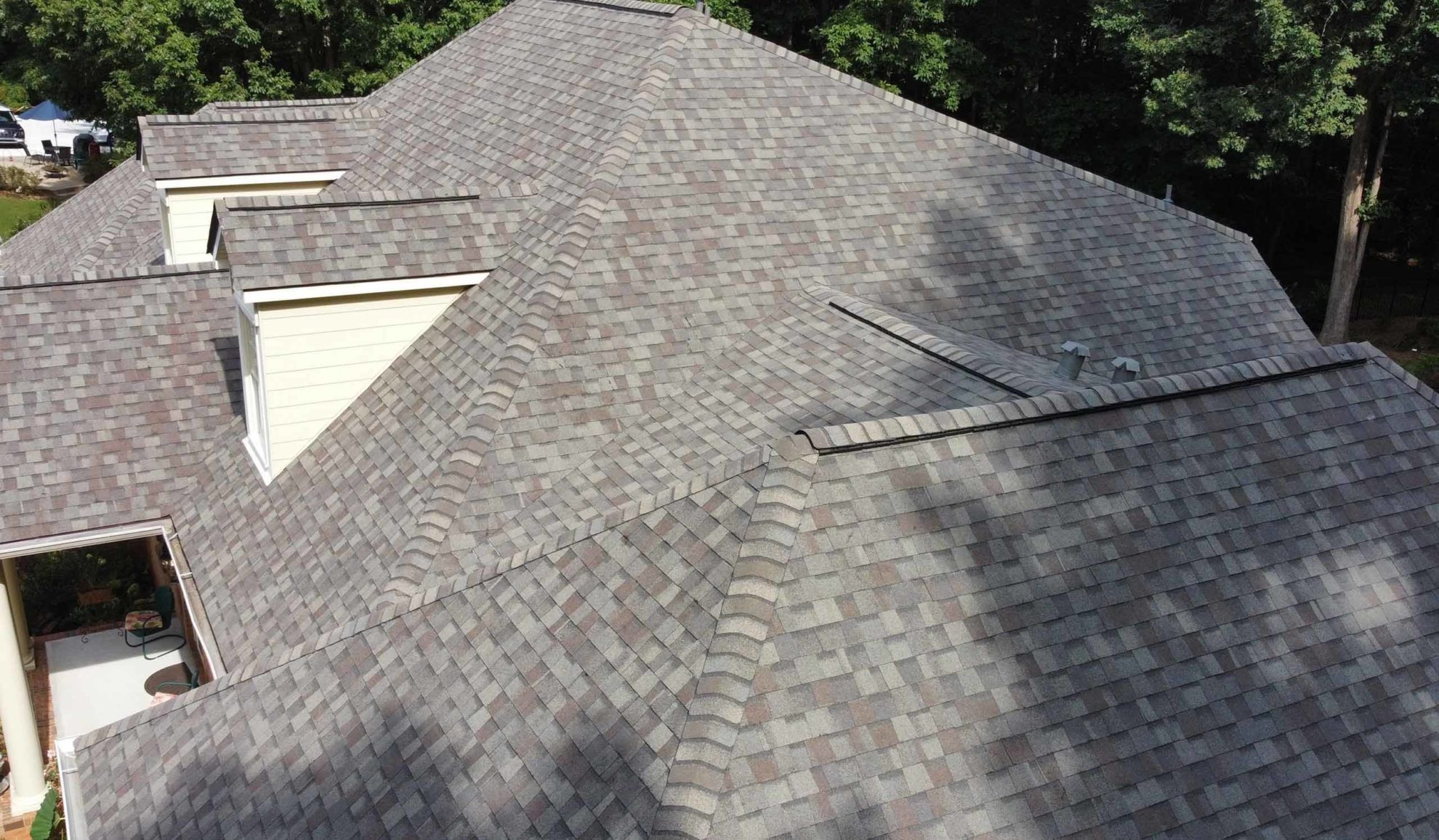 house exteriors roof close up with repaired asphalt shingles roofing woodstock ga
